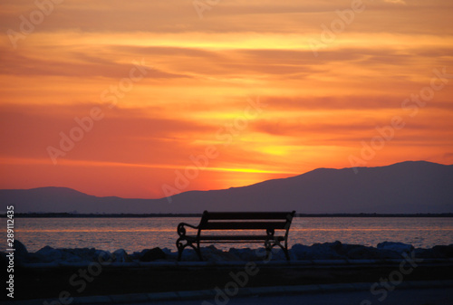 Empty bench overlooking the sunset of izmir, Turkey