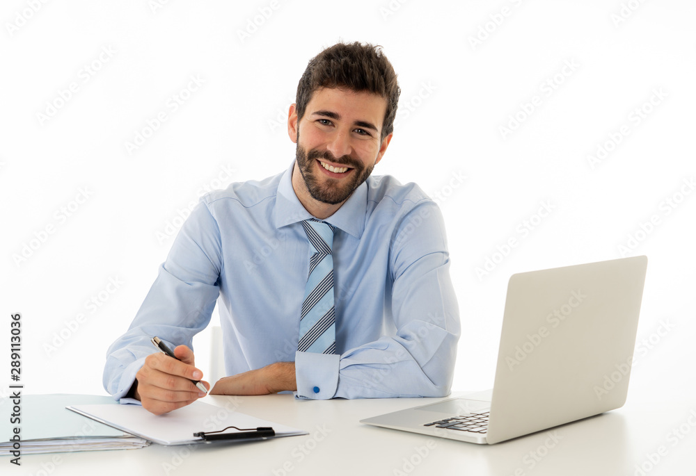Attractive happy Young caucasian businessman working on laptop computer feeling successful at work Attractive happy Young caucasian businessman working on laptop computer feeling successful at work