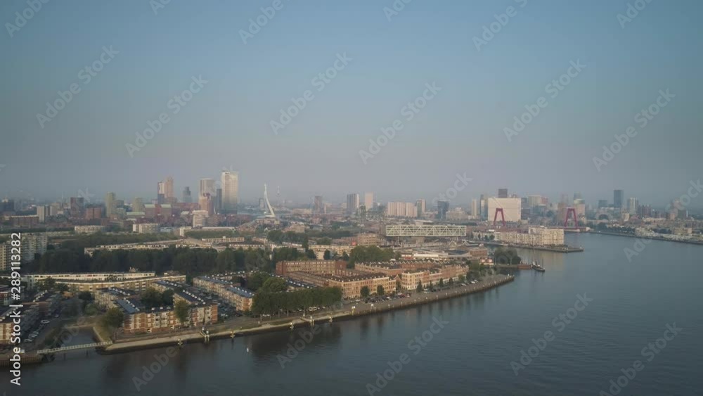 Rotterdam Skyline with Erasmusbrug bridge at sunset in morning in Rotterdam, Netherlands Rotterdam Skyline with Erasmusbrug bridge at sunset in morning in Rotterdam, Netherlands