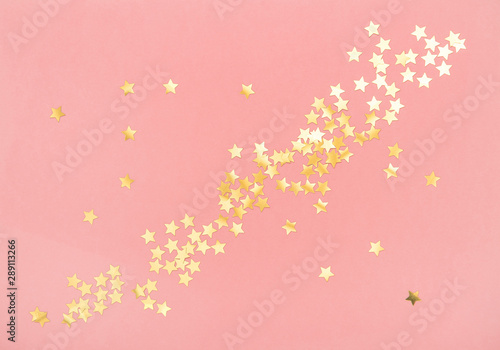 Golden confetti pink color background Holidays flat lay
