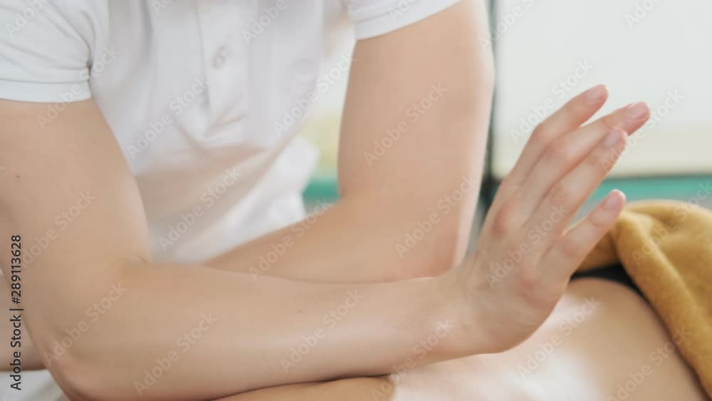 custom made wallpaper toronto digitalMale masseur doing massage. Young woman receiving oil massage in spa salon. Close-up view in slow motion. Body relaxation and skin care