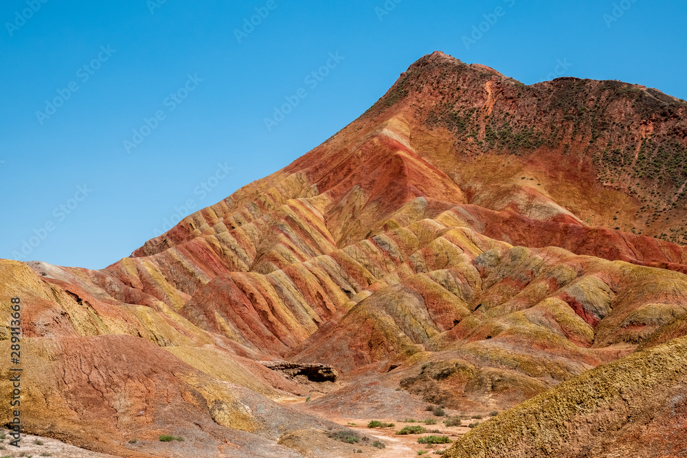 Fototapeta premium China. Zhangye Danxia geological park, China. Situated in a canyon with beautiful rock formations, sand stone, geological layers of stone and stunning views. Zhangye, Gansu province, China.