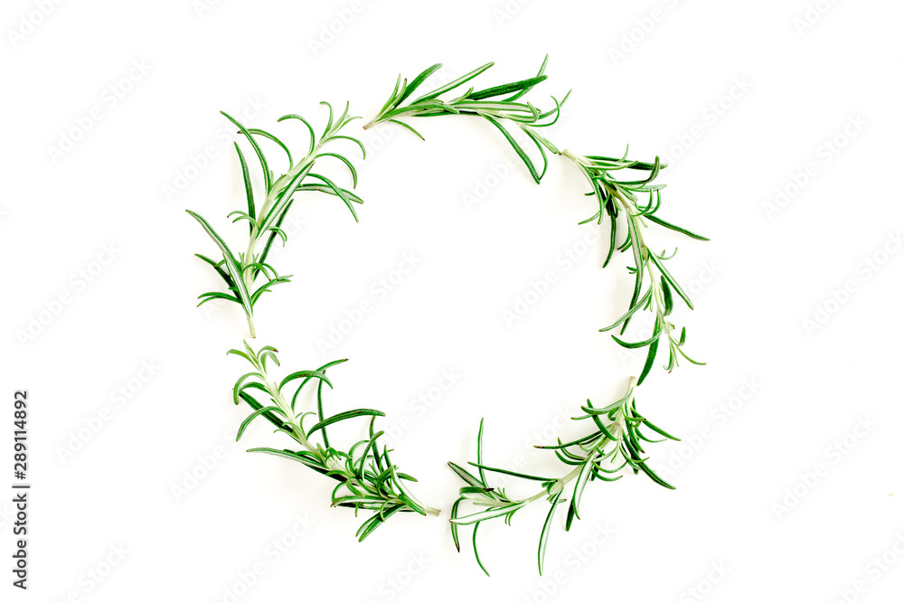 Round wreath frame made herbs, green branches, leaves rosemary. Flat lay. Top view.