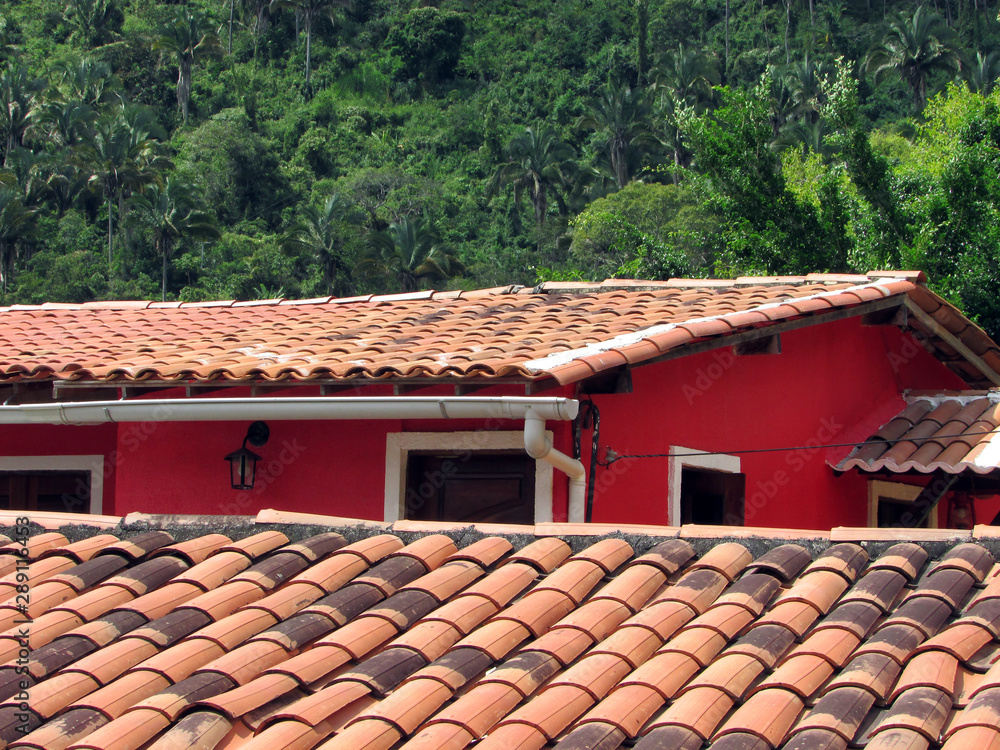 Red hovel stone roof near Baturite forest Red hovel stone roof near Baturite forest