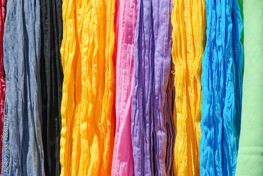 Traditional French scarfs of various colors on a shop.
