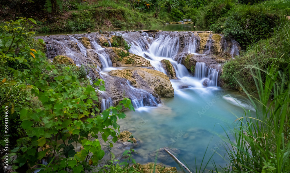 Waterfall at Pu Luong, Mai Chau area, Vietnam. Long exposure smooth flow of crystal clear water. Waterfall at Pu Luong, Mai Chau area, Vietnam. Long exposure smooth flow of crystal clear water.