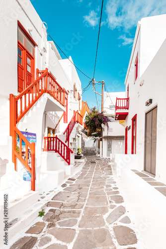 Typical Greek architecture in the white, cobbled alleys of Mykonos town, houses in the old town of Chora with colorful balconies and white churches, Cyclades, Greece © Thomas Jastram