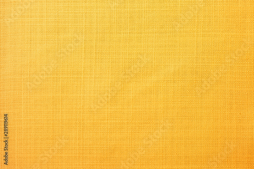 Golden yellow linen fabric of table cloth texture background photo