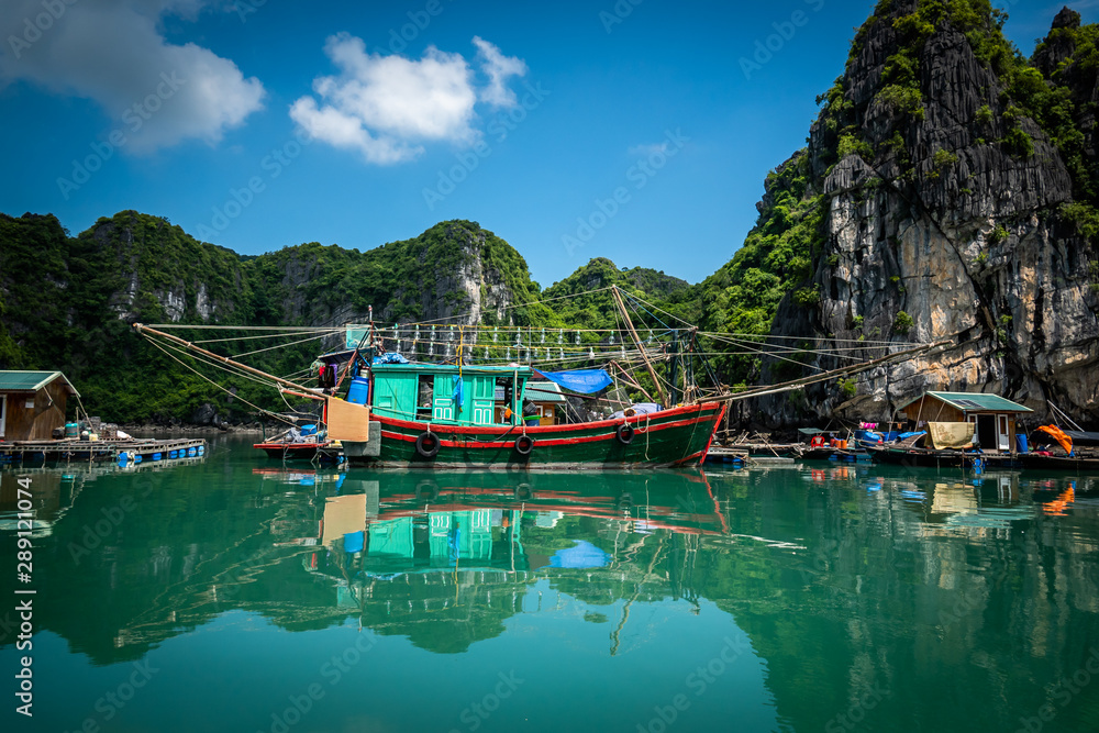 Big fishing boat at Vung Vieng floating village in Halong Bay, Vietnam.