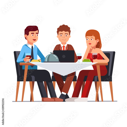 Business client meeting at restaurant table. Partners team having informal dinner discussing matters