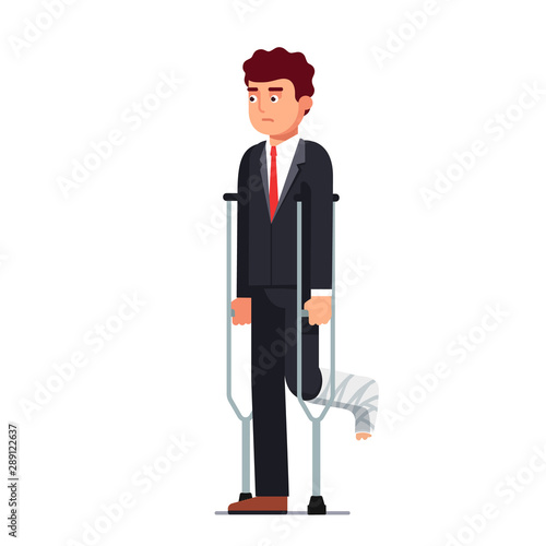 Sad business man with broken leg bandage cast