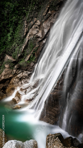 Stunning silky smooth waterfall. Long exposure shot of crystal clear fall at hoang su phi  vietnam. Ha Giang province landscape. Yoga and meditation concept. 