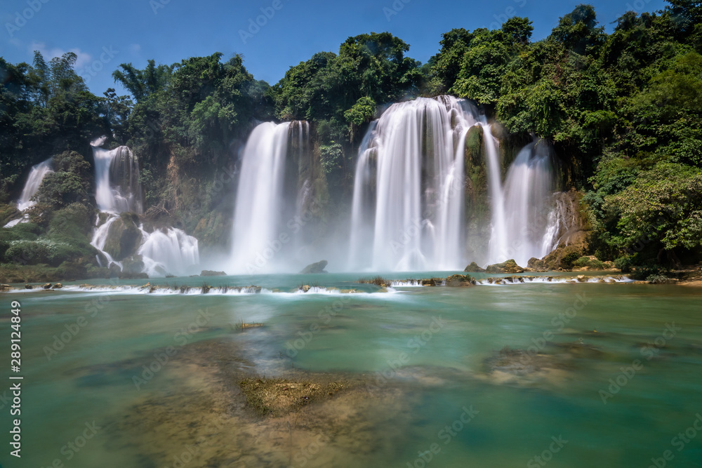 Bangioc or Detian waterfall in Cao bang, north Vietnam. These falls form the natural border between Vietnam and China. Slow shutterspeed silky smooth waterfalls.