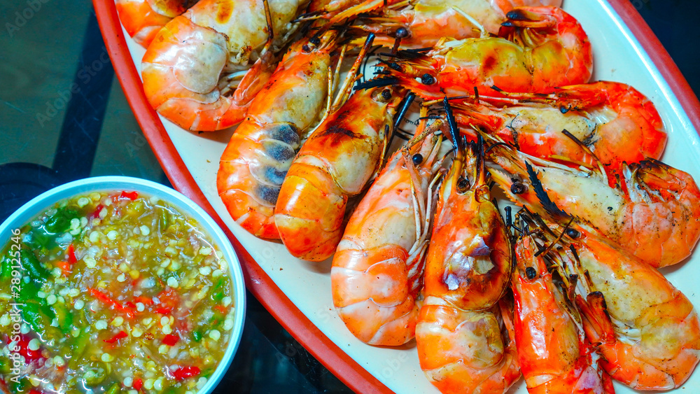 Roasted grilled giant river shrimp or prawn served with spicy seafood ...