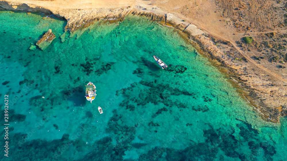 Aerial drone photo of picturesque and traditional colourful fishing boat docked in port of Koufonisi island, Small Cyclades, Greece
