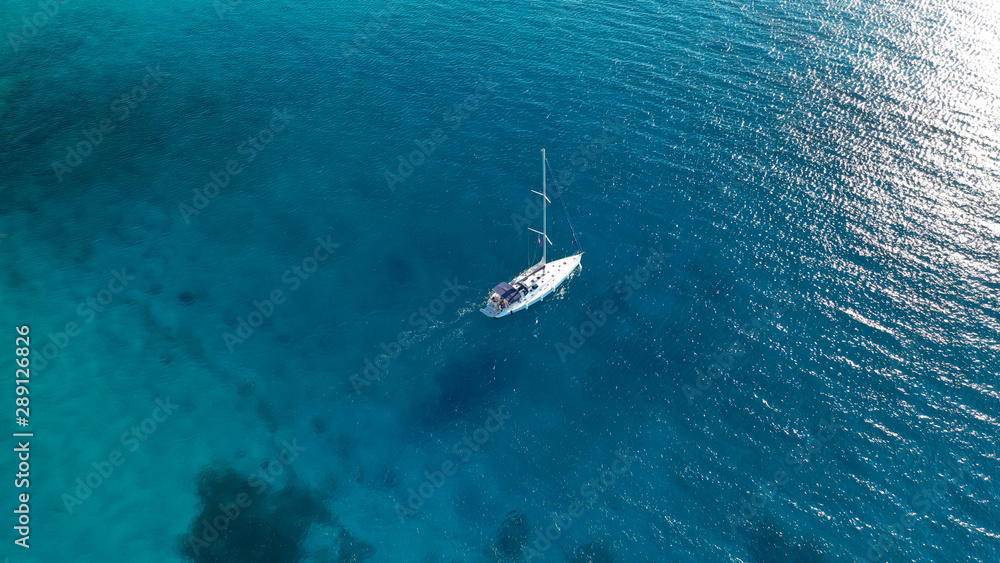 Aerial drone photo of luxury sail boat cruising in the deep blue Aegean sea, Greece Aerial drone photo of luxury sail boat cruising in the deep blue Aegean sea, Greece