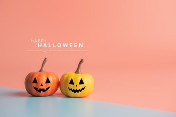Happy Halloween message, Pumpkin on pastel paper background.
