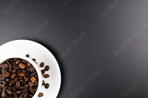 Принти на полотні cup of coffee and coffee beans on dark background