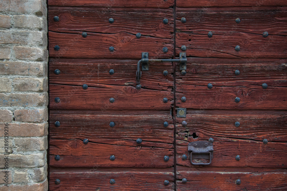 Antique wooden door painted in red Antique wooden door painted in red