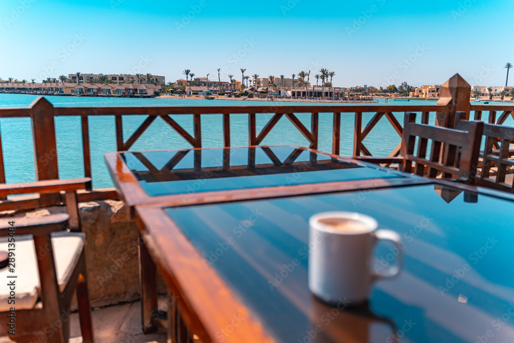 blurry Coffee in front of a lagoon El Gouna beach, Red Sea, Egypt blurry Coffee in front of a lagoon El Gouna beach, Red Sea, Egypt