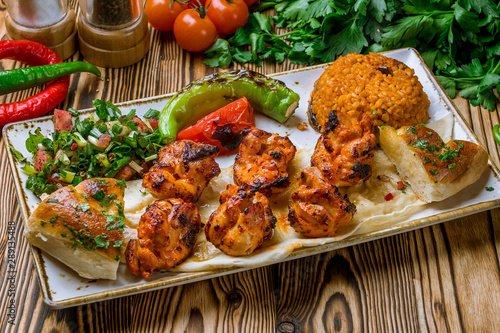 chicken kebab Turkish cuisine on wooden table