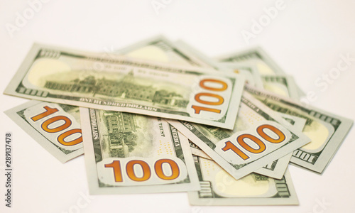 Stacks of paper 100 dollars USA on the white background