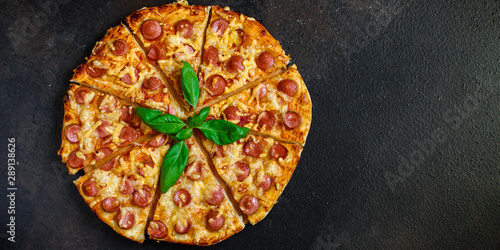 pizza sausages salami and cheese hot and fresh (ingredients). hot pizza. Top view. copy space