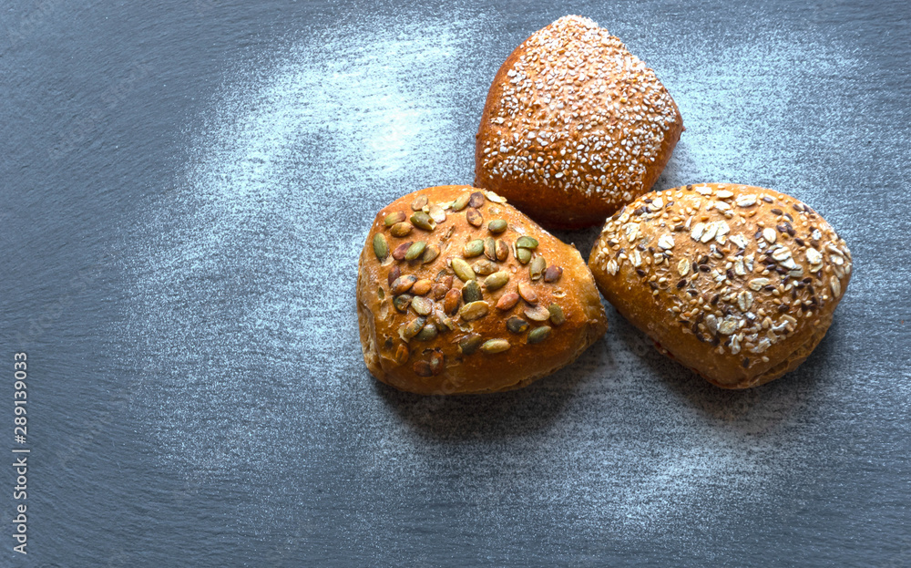 .several varieties of wholegrain bread rolls .several varieties of wholegrain bread rolls