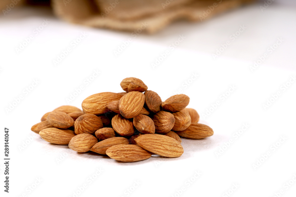 Almond. Almond nuts, close-up isolated on a white background Almond. Almond nuts, close-up isolated on a white background