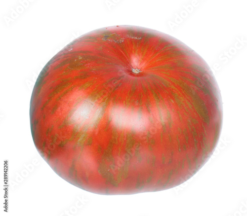 Red tomato with green stripes isolated on white background