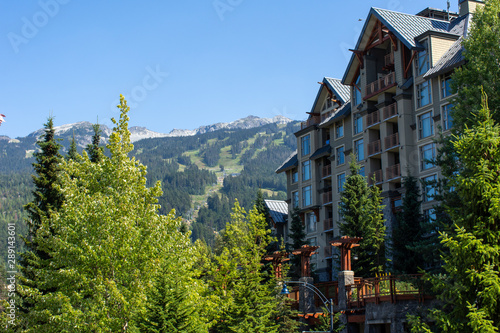 Whistler Mountain in British Columbia, Canada looking to the summer ski lifts and Gondola at Blackcomb and the village accommodations on a sunny day.