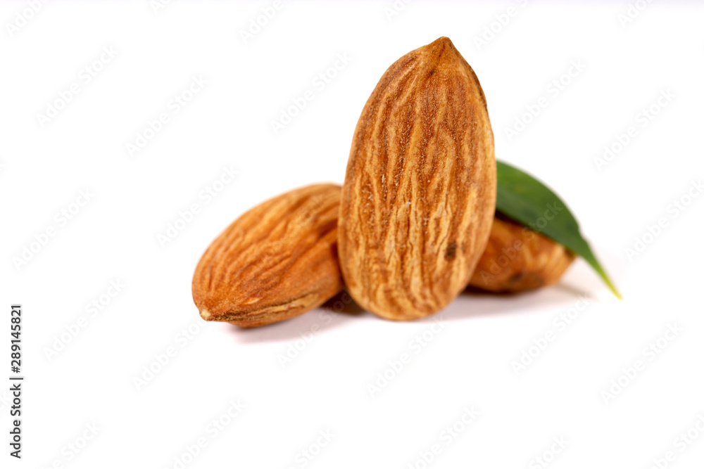 Almond. Almond nuts, close-up isolated on a white background Almond. Almond nuts, close-up isolated on a white background