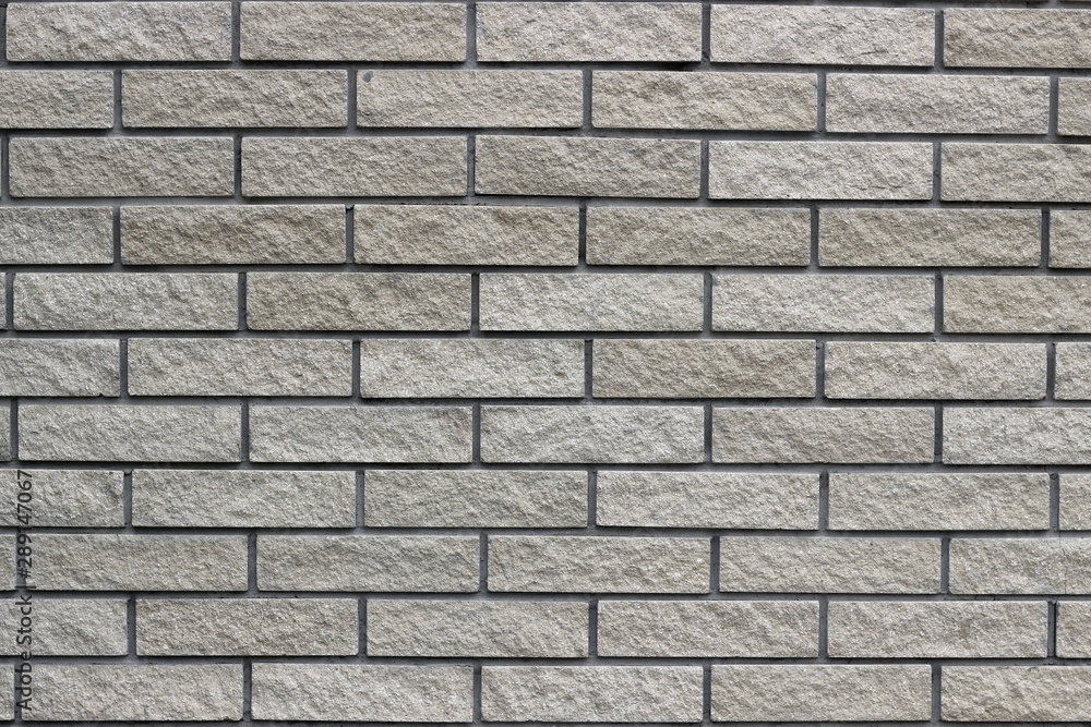 Modern grey brick wall. Space for text or logos Modern grey brick wall. Space for text or logos