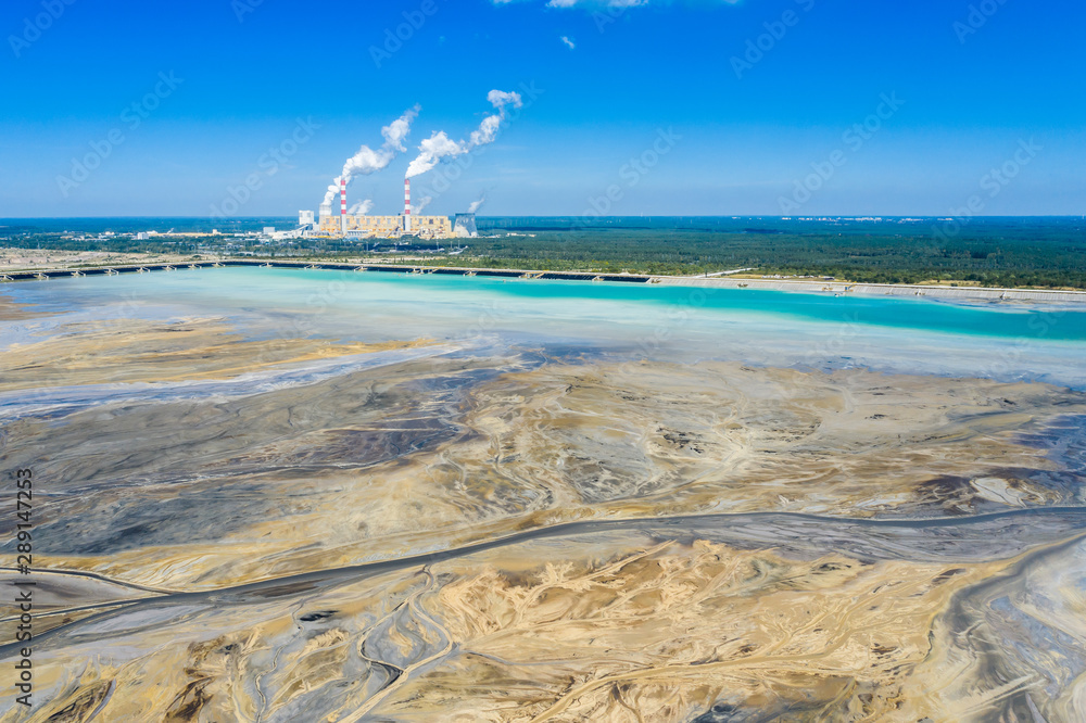 Surface coal mining and power station in Poland. Destroyed land. View from above. Surrealistic landscape.