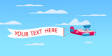 Red retro biplane aircraft pulling advertisement banner