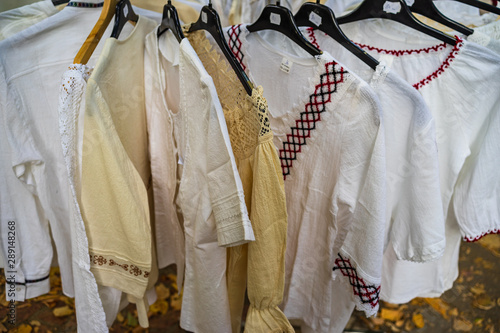 Hand embroidered traditional Romanian peasant blouse - Romanian Ie (ie romaneasca) exhibited on a stand at a food festival in Bucharest, Romania – 2019 photo