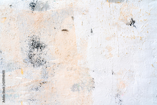 White and beige paint on the wall of a house. Construction and repair. © sandipruel