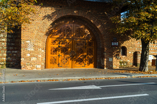 Wooden door at the entrance of Stelea Monastery – Nifon House Museum in Targoviste, Romania – 2019 photo