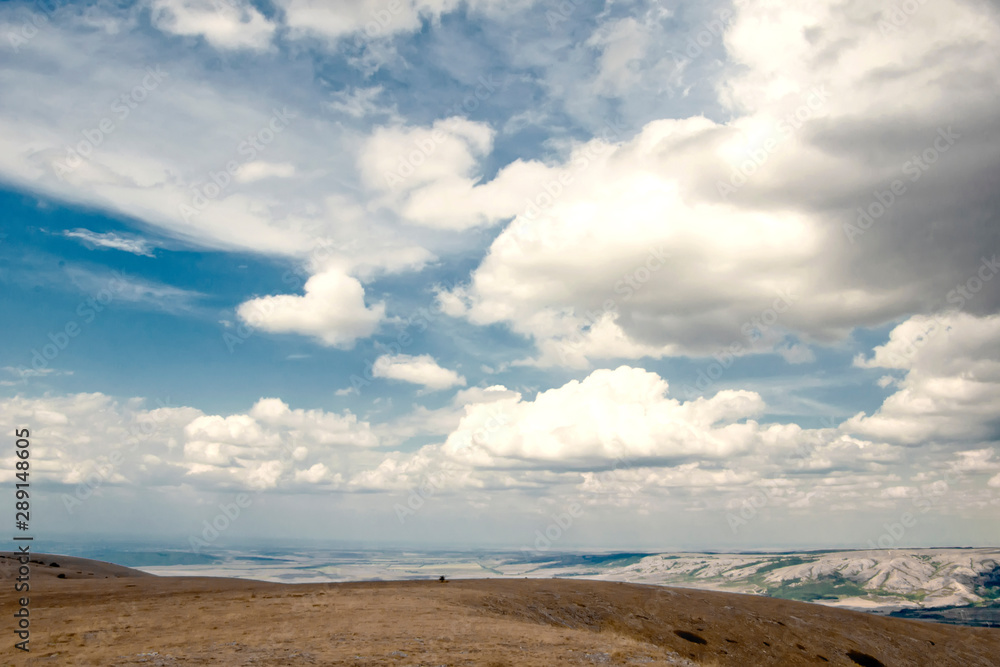 Mountains in the Crimea. Beautiful blue sky and large white clouds. Autumn. Mountains in the Crimea. Beautiful blue sky and large white clouds. Autumn.