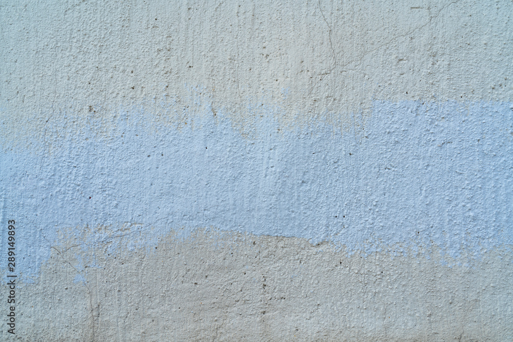 Fototapeta premium White and beige paint on the wall of a house. Construction and repair.