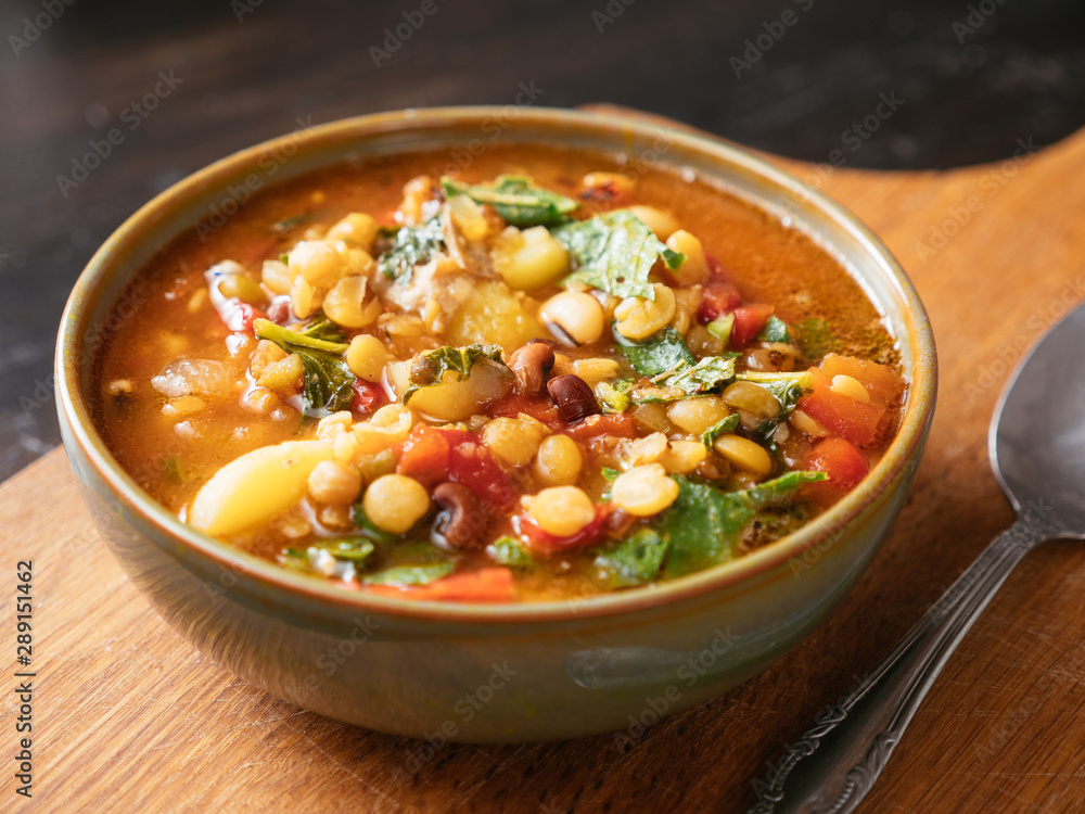 Bowl with a 5 bean soup with turnip greens. Bowl with a 5 bean soup with turnip greens.