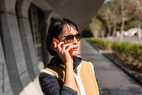 Asian mature beauty talk on the cellphone