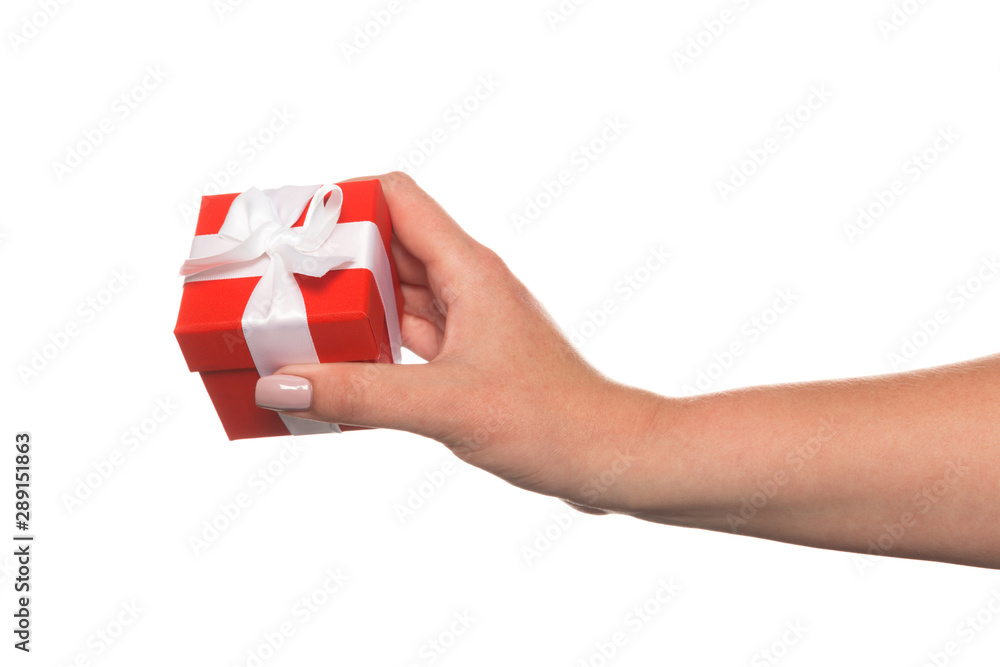 Hands holding a beautiful gift box, woman gives a gift, isolated on white background Hands holding a beautiful gift box, woman gives a gift, isolated on white background
