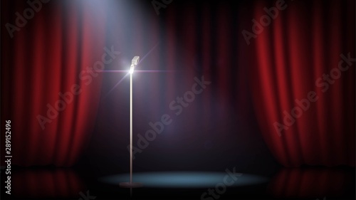 A scene with a red curtain and a standing microphone. Concert, show, performance