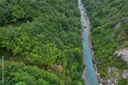 river at the foot of the mountains