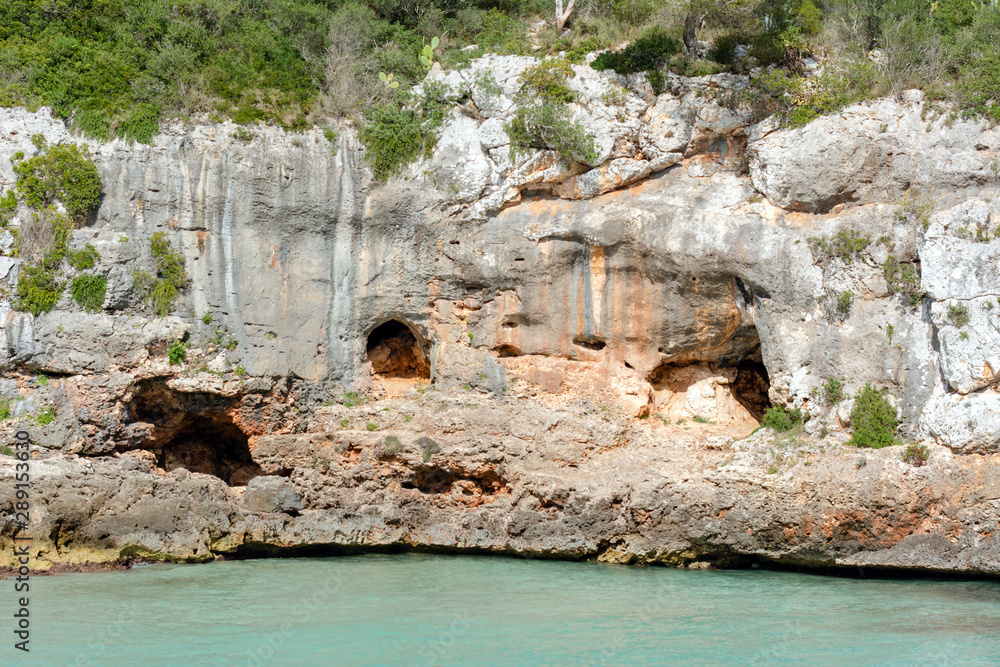 Caves on the beach Cala Ferrera, a popular family destination in the south-east of Mallorca. Spain