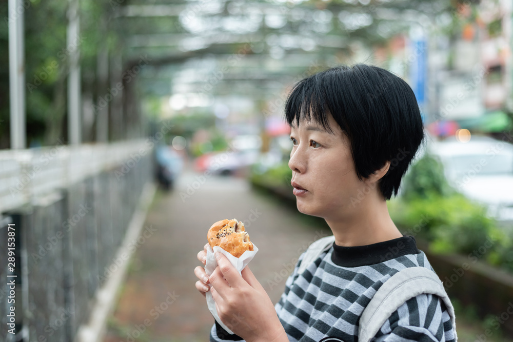 woman eat traditional Taiwanese snack woman eat traditional Taiwanese snack