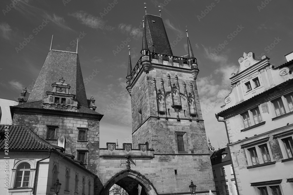 Black and white photo of the powder Tower taken off the Charles Bridge in Prague