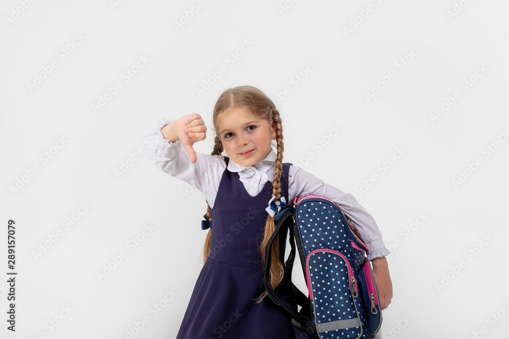 girl school girl in school uniform sad shows fingers down on white isolated background girl school girl in school uniform sad shows fingers down on white isolated background