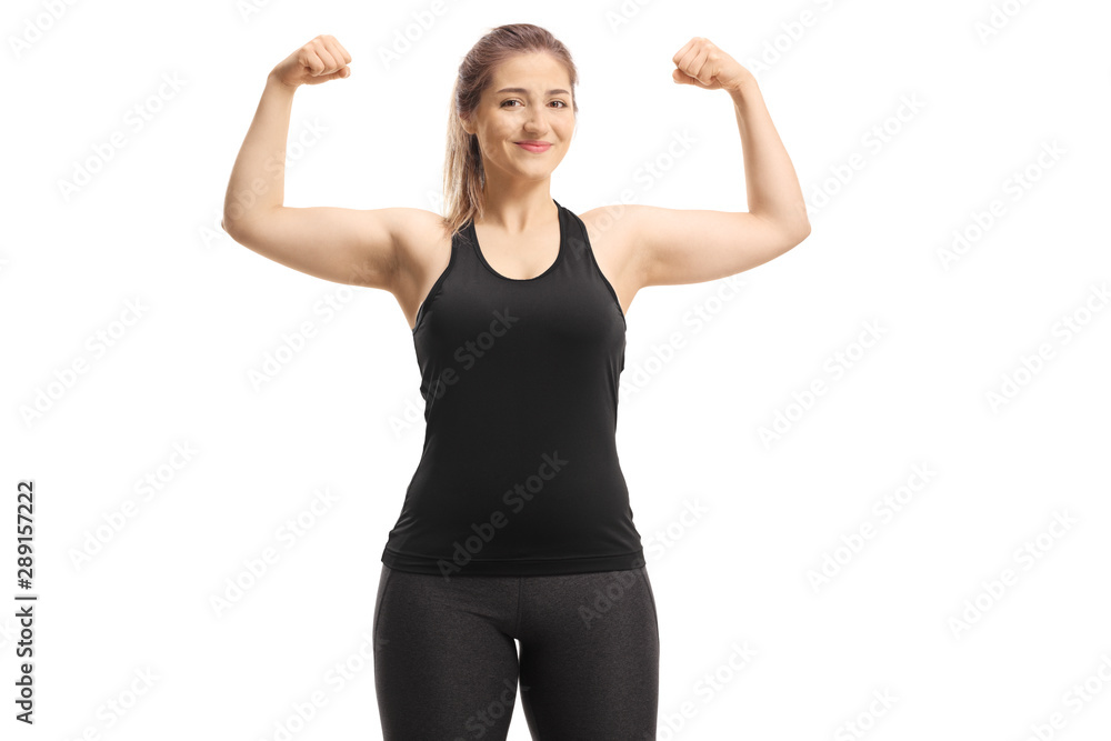 Healthy young woman smiling and showing muscles Healthy young woman smiling and showing muscles